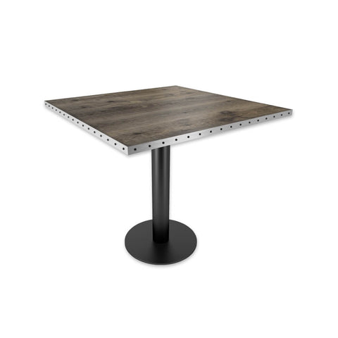 Copito grey bar table with metal trim top and black pedestal base