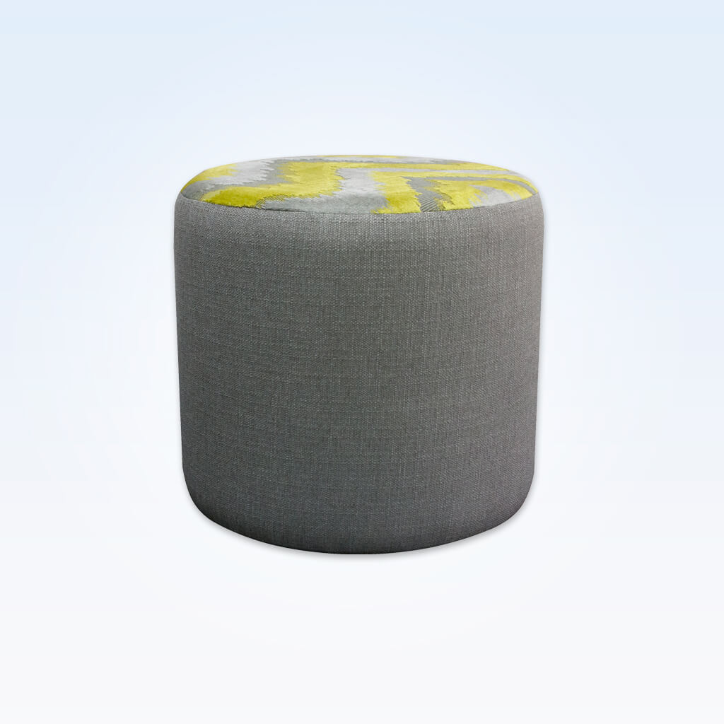 Enya upholstered grey circle ottoman with contrast fabric to the top
