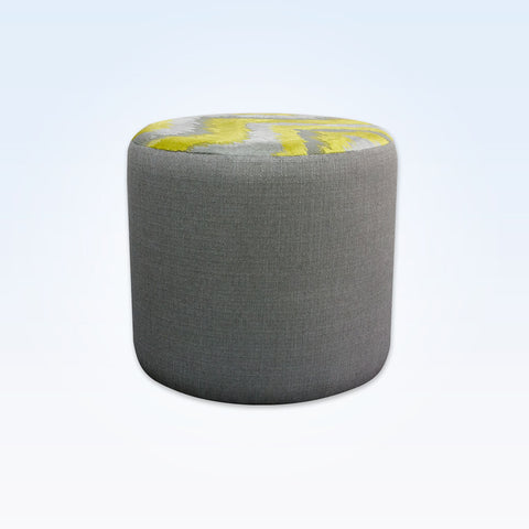 Enya upholstered grey circle ottoman with contrast fabric to the top