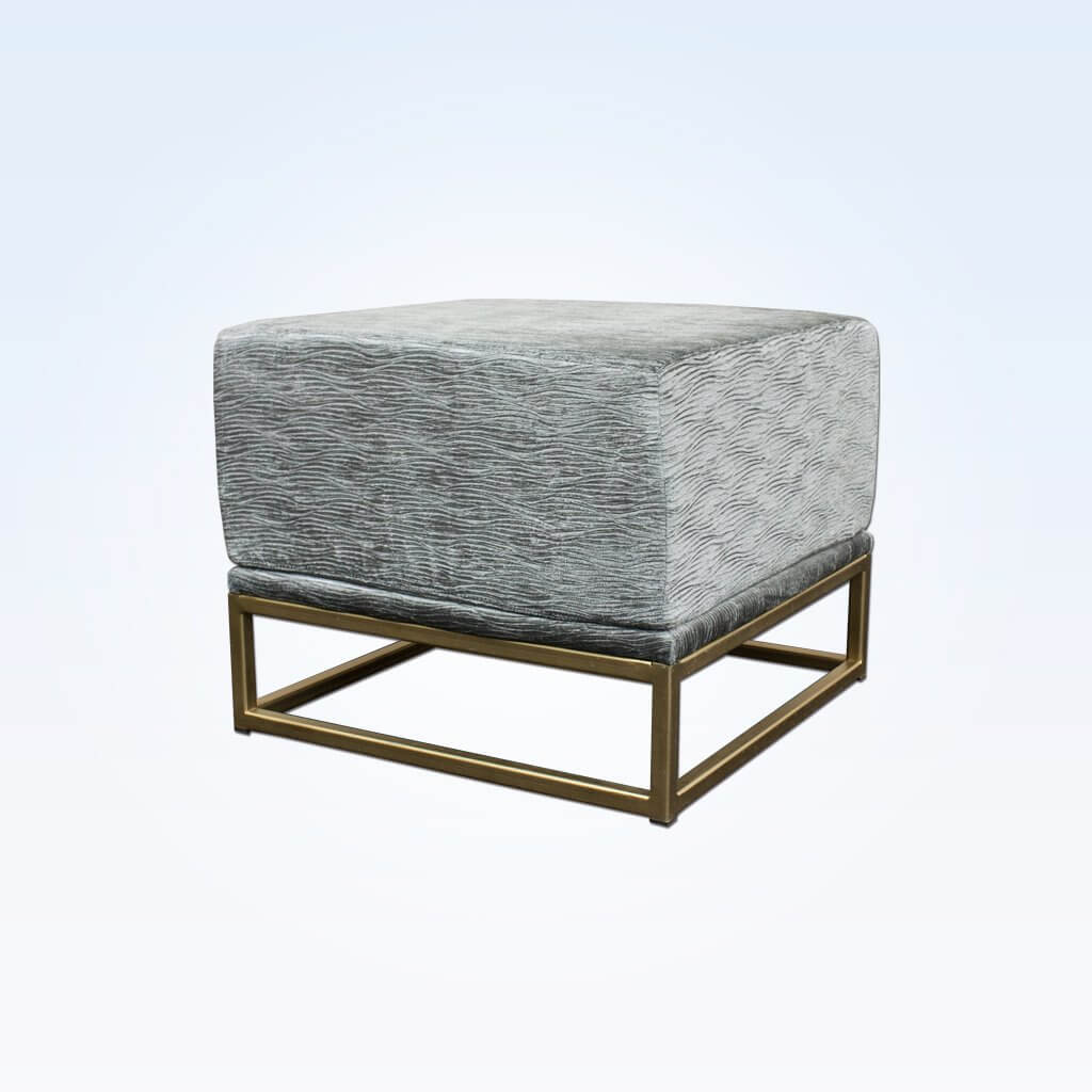 Kemi grey and gold ottoman fully upholstered cushioned top sitting on a gold open frame base
