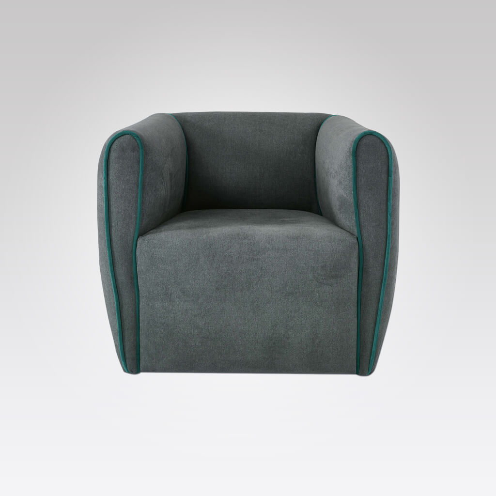 Penza grey upholstered lounge chair with piping detail to arms 