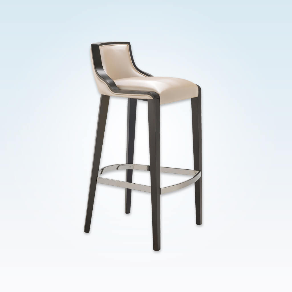 River beige bar stool with leather upholstered cushion and dark show wood trim to the backrest. Tapered timber legs with a chrome metal kick plate