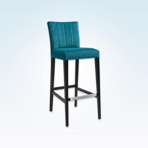Sage blue bar stool with upholstered cushion featuring decorative stitching to the backrest and a wooden frame with metal trimmed kick plate