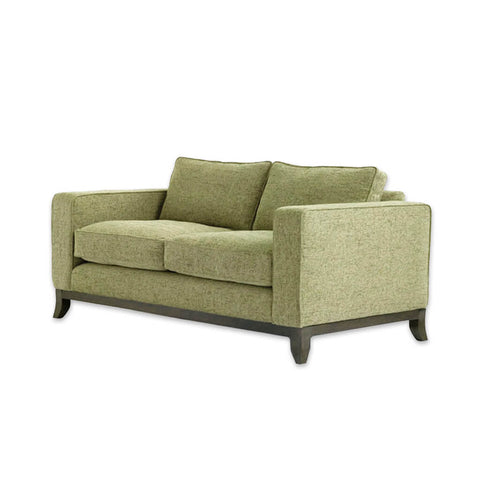 Winchester lime green fabric sofa with deep padded cushions and splayed wooden feet