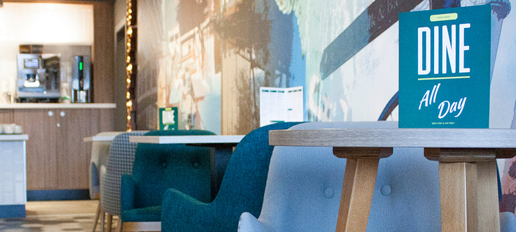 Teal and Greu Tub Chairs in Bar Area of Hotel