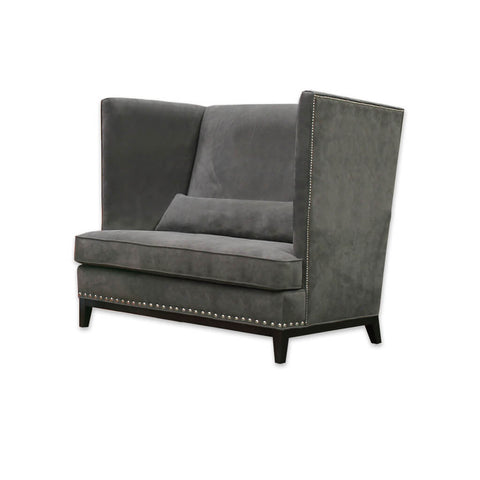 Aneto dark grey fabric accent chair with a show wood plinth and decorative studding 
