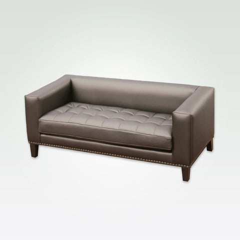 Blog brown studded sofa with square arms and back, decorative buttoning to the seat cushion