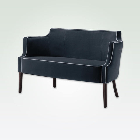 Brizio dark blue fabric sofa with contrast piping and exaggerated curved back and arms sitting proud on slim wooden legs 
