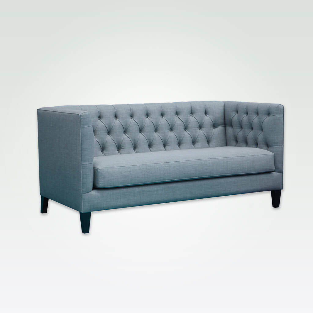 Diamond light blue fabric sofa with deep buttoning to back and arms and tapered feet 