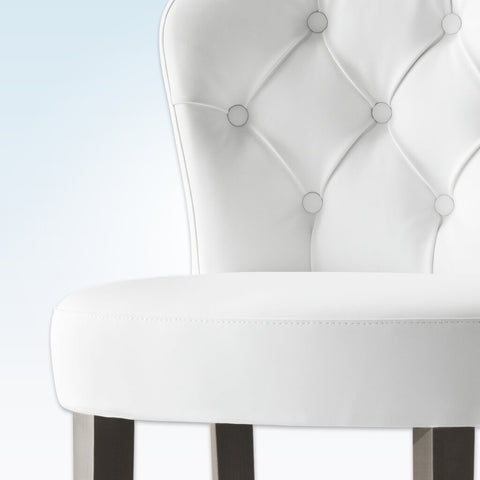 Euforia curved white bar chair with buttoning detail round seat and tapered timber legs with a round metal kick plate