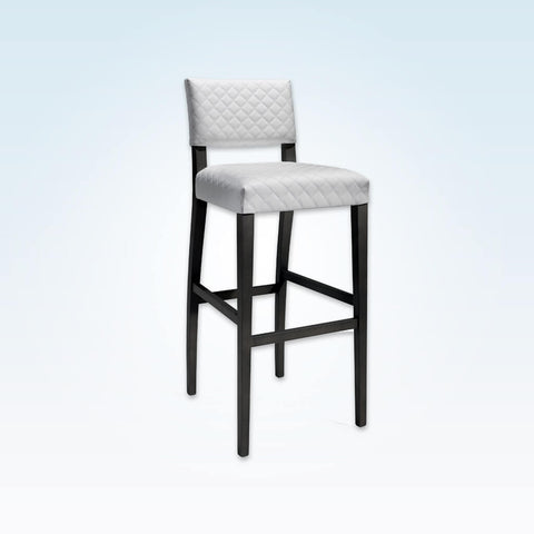 Keela white and black bar stool with textured upholstery and black wooden legs