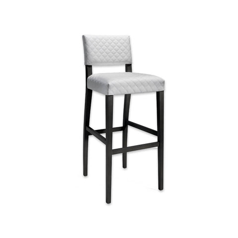 Keela white and black bar stool with textured upholstery and black wooden legs