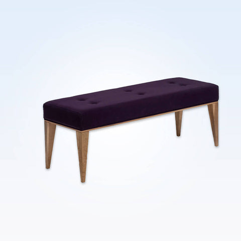 Margot dark purple ottoman with deep buttoning to the padded cushion and tapered gold legs
