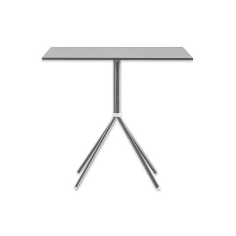 Nolita metallic dining table with tubular steel legs and square top