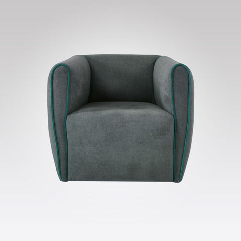 Penza grey upholstered lounge chair with piping detail to arms 