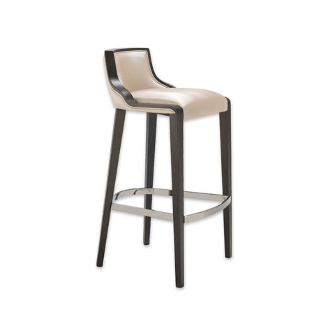 River beige bar stool with leather upholstered cushion and dark show wood trim to the backrest. Tapered timber legs with a chrome metal kick plate