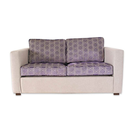 Trinity purple fabric hotel sofa bed with contrasting cushions and upholstered frame 
