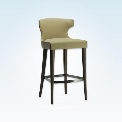 Una green bar stool with hammer head back rest and show wood rear. Featuring tapered legs and curved kick plate